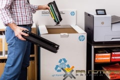 Business Man Recycling in HP Planet Partners Recycle Box