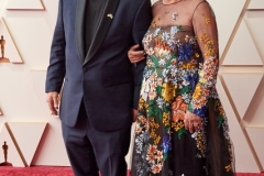 94th Oscars® nominee Hank Corwin arrives with guest on the red carpet of the 94th Oscars® at the Dolby Theatre at Ovation Hollywood in Los Angeles, CA, on Sunday, March 27, 2022.